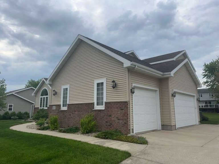 A well-maintained home with a combination of siding and brick exterior