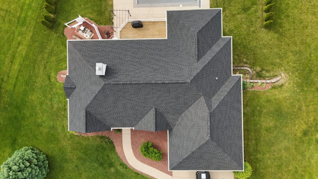 An aerial view of a well-maintained roof on a residential home