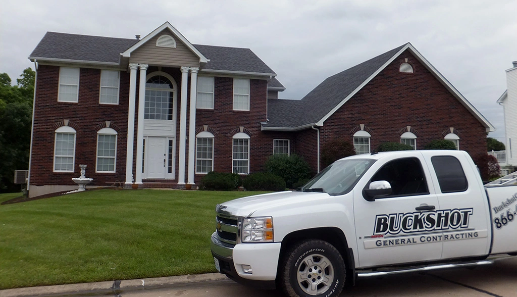 Complete exterior restoration with new roof and vinyl siding on Madison WI home by Buckshot General Contracting