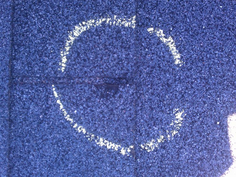 Close up of a damaged roof shingle